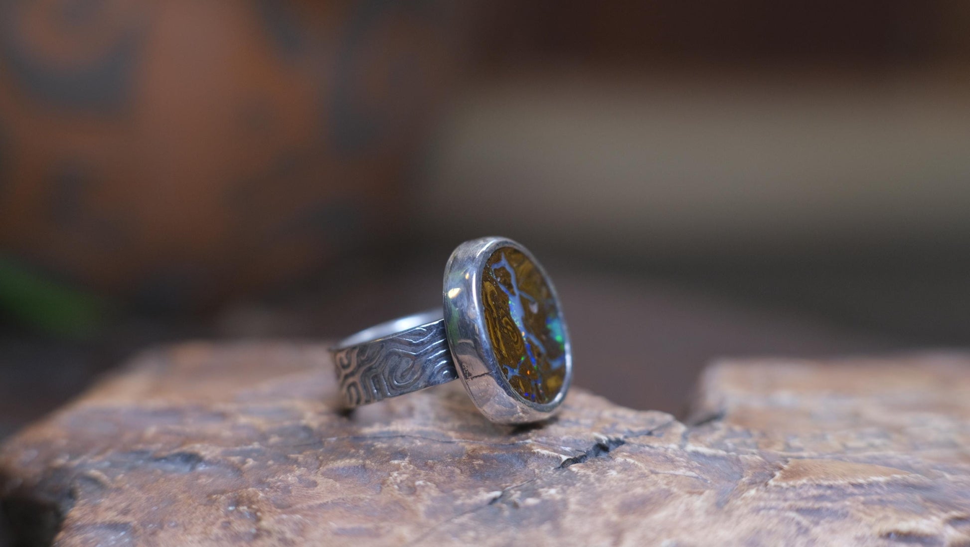 Striking Australian Boulder Opal Set on Rippled Sterling Silver Ring