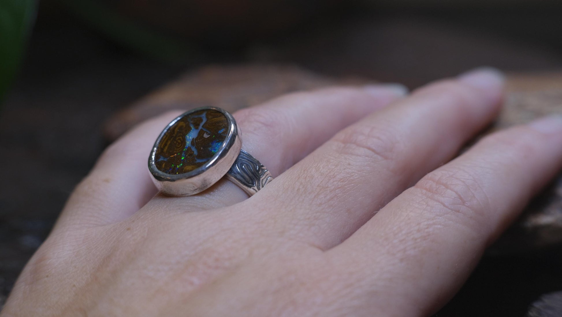 Striking Australian Boulder Opal Set on Rippled Sterling Silver Ring