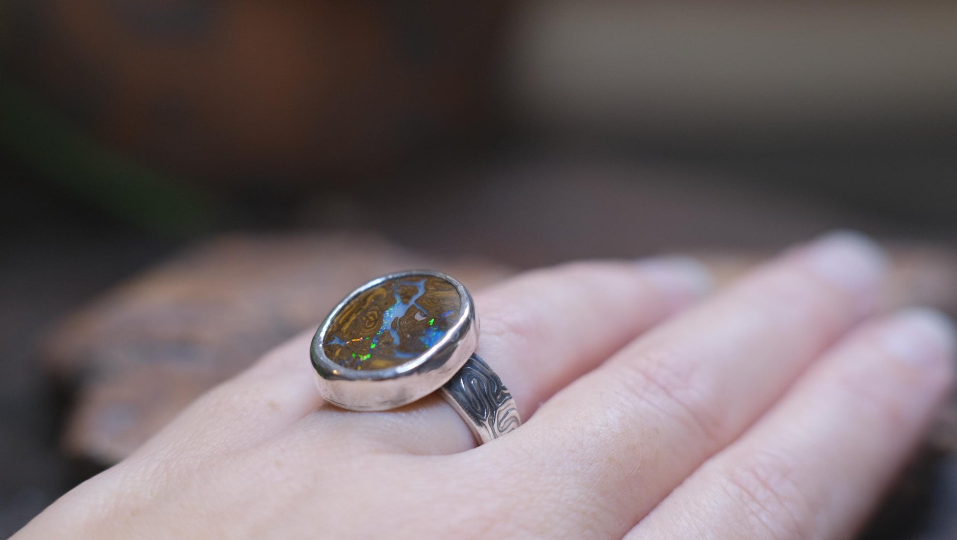 Striking Australian Boulder Opal Set on Rippled Sterling Silver Ring